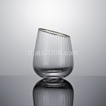 Slanted tumbler glass na may gintong rim